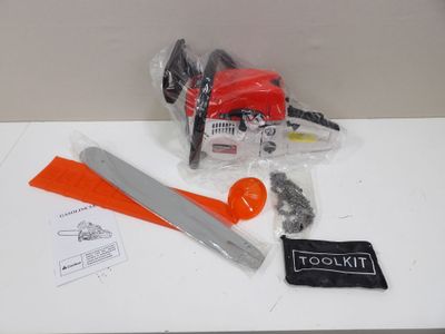 a chainsaw, a saw, and other tools on a table