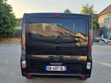 a small black van parked in a parking lot