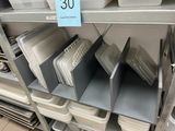 a lot of trays on the shelves in the store