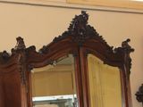 a large mirror on the wall in the corner of the room