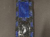 a close up of a blue and black beaded neck piece on a mannequin