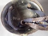 a close up of a helmet with a strap on it