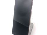 a cell phone that is sitting on top of a stand