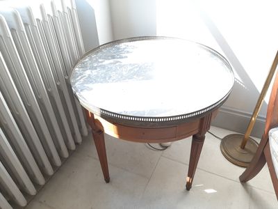 a small table with a mirror on top of it