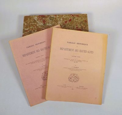 three books sitting on top of each other on top of a table