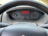 dashboard view of a car with a steering wheel and dashboard gauges