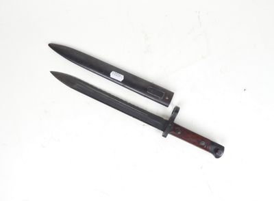 a knife that is laying on a table