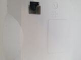 a white electrical outlet on the wall with two black outlets