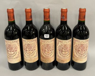 six bottles of wine are lined up in a row