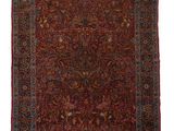 un tapis rouge avec un motif floral sur fond blanc