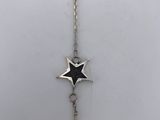 a necklace with a star on it and a chain attached to it