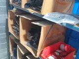 many boxes that are sitting on the shelves in the room