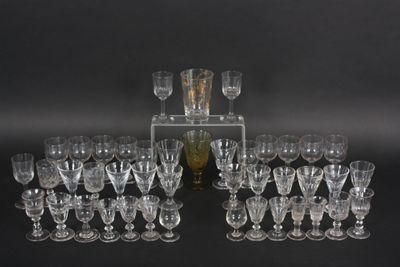 a lot of glasses that are sitting on a table