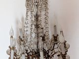 a chandelier hanging from the ceiling in a room