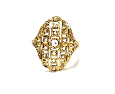 a close up of a gold ring on a white background