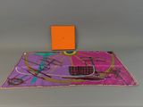 purple and orange scarf with orange square on top of it