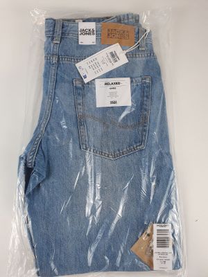 the back of a pair of blue jeans wrapped in plastic