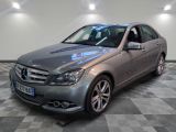 the mercedes c - class is parked on a checkered floor