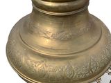 a gold vase with a chain around it on a white background