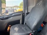 a seat in the back of a van with a seat belt