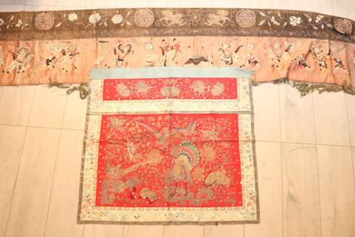 a red oriental rug on the floor in a room