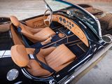 a black car with tan leather seats and a steering wheel