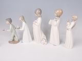 five figurines of people standing in a line