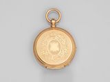 an image of a gold pocket watch on a white surface