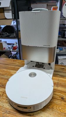 a coffee maker sitting on top of a wooden table