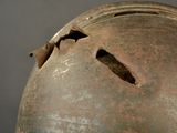 a close up of a helmet with holes in it