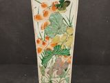 an image of a vase with flowers and birds painted on it