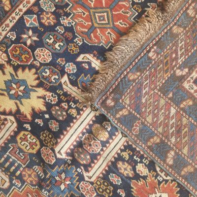 an image of a cat laying on top of a rug on the floor