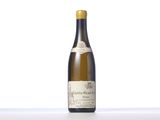 a bottle of white wine sitting on top of a table