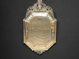 a mirror that is on the wall with a black background