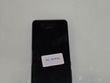 a cell phone that has a sticker on it