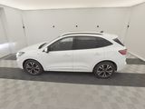 the white car is parked in the garage of the house