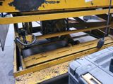 a machine that is working on a piece of metal