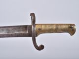 a close up of a very old looking knife on a table