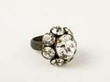 a close up of a ring on a white surface
