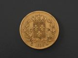 a gold coin with a coat of arms on it