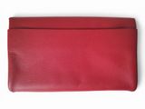 a red leather wallet on a white background