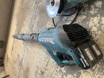 two electric tools that are sitting on the floor
