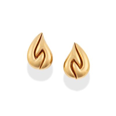 a pair of gold earrings on a white background