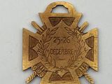 an image of a gold medal with a cross on it