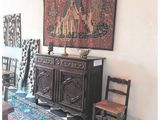 an image of a living room with a rug and a table
