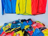 many different types of clothing on display on a table