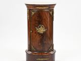an image of a small wooden cabinet with a marble top
