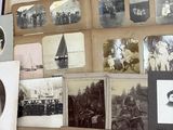a lot of old photos on the table together