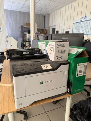 a printer sitting on top of a table in a room