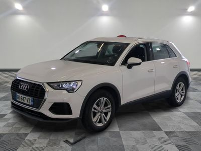 the white audi suv is parked on a checkered tile floor